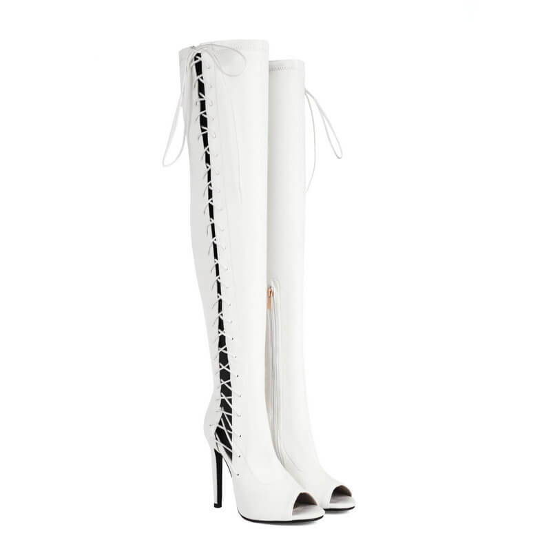 Bottes blanches à brides creuses au-dessus du genou